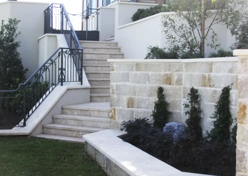Cut limestone garden walls and steps