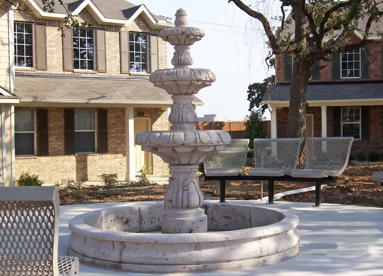Tiered cantera fountain in a public plaza