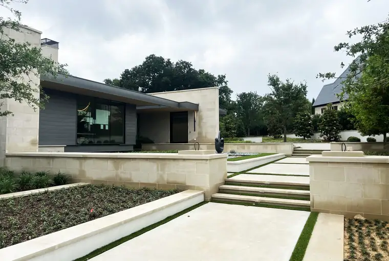 Limestone walls, steps and paving on a contemporary Dallas home